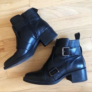 Black leather ankle booties with buckles